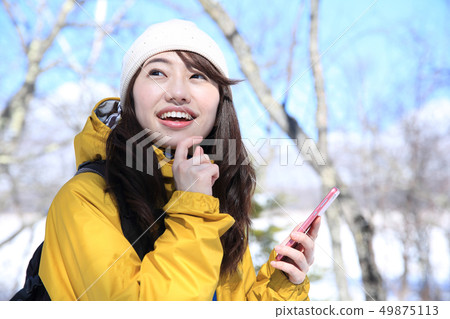 Woman enjoying winter leisure Woman enjoying winter leisure 49875113