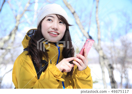 Woman enjoying winter leisure Woman enjoying winter leisure 49875117