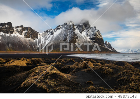 Sunset at Vestrahorn Mountain and Stokksnes beach. Iceland Sunset at Vestrahorn Mountain and Stokksnes beach. Iceland 49875148