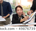 Asian businesswoman is sign her document. 49876739