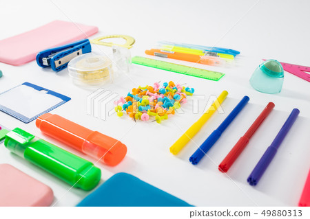 Pencils and tape lying with notes and markers 49880313