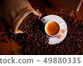 Cup of espresso with coffee beans and old grinder 49880335
