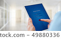 Male hands holds a tablet with online banking 49880336
