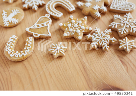 Christmas gingerbread on wooden table Christmas gingerbread on wooden table 49880341