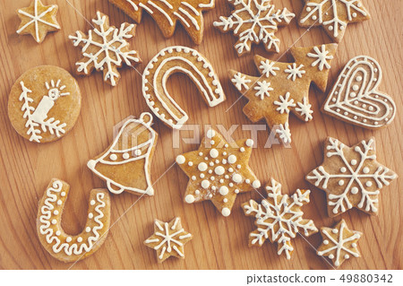 Homemade christmas cookies on wooden table Homemade christmas cookies on wooden table 49880342