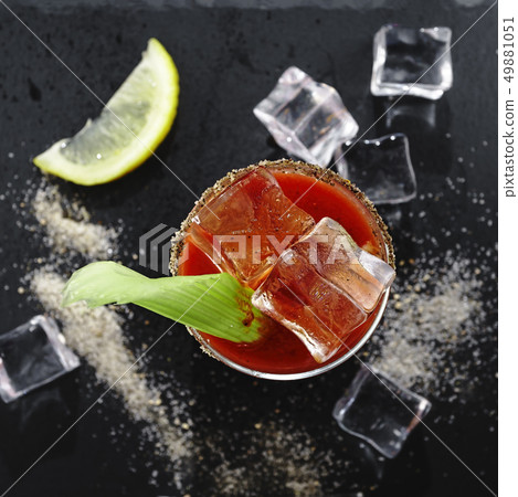 Bloody Mary, Cocktail, stone background, top view, vodka, tomato juice with celery, lemon and Bloody Mary, Cocktail, stone background, top view, vodka, tomato juice with celery, lemon and 49881051