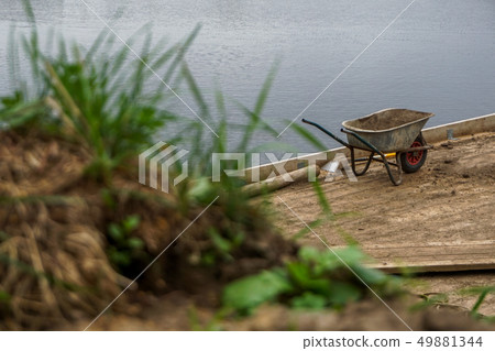 Wheelbarrow for construction in site building Wheelbarrow for construction in site building 49881344