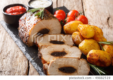 Festive baked pork stuffed with prunes with new Festive baked pork stuffed with prunes with new 49882519