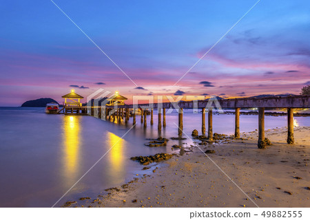 The bridge that stretches out the sea at sunset 49882555
