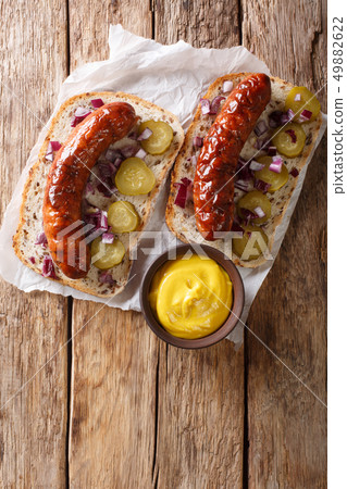 Austrian sandwiches with grilled sausages, pickled Austrian sandwiches with grilled sausages, pickled 49882622