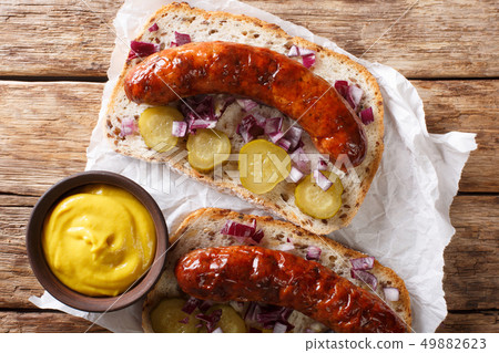 Delicious toasts with grilled sausages, pickled 49882623