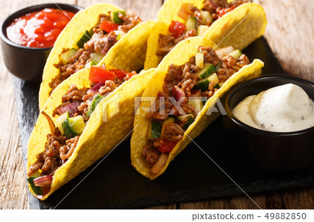 Authentic tacos with minced beef, cheese and 49882850