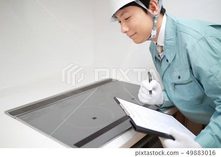 Worker (vendor maintenance repair building construction business IH stove kitchen copy space) 49883016