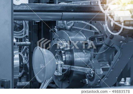 The robotic arm keep the plastic blow part . The robotic arm keep the plastic blow part . 49883578