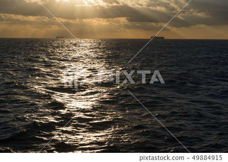 Cargo ship sun sea 49884915