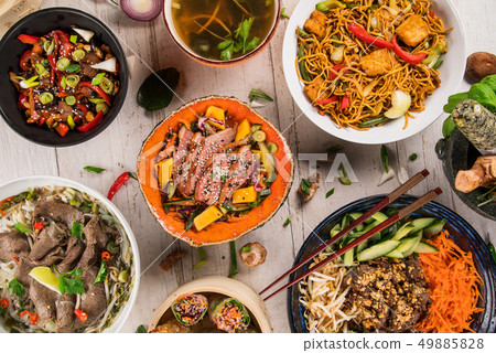 Asian food background with various ingredients on rustic wooden table. 49885828