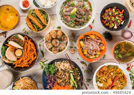 Asian food background with various ingredients on rustic wooden table. 49885829