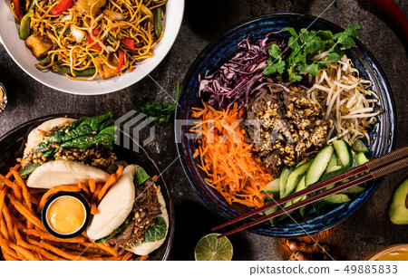Asian food background with various ingredients on rustic stone background , top view. 49885833