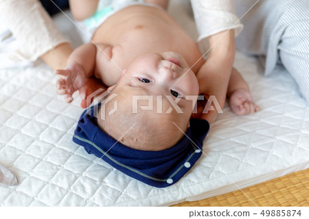 Baby changing clothes Baby changing clothes 49885874