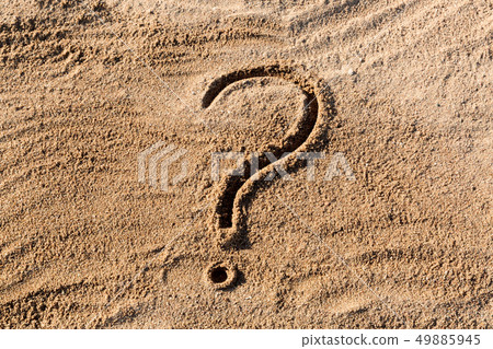 question marks written on beach sand close up, 49885945