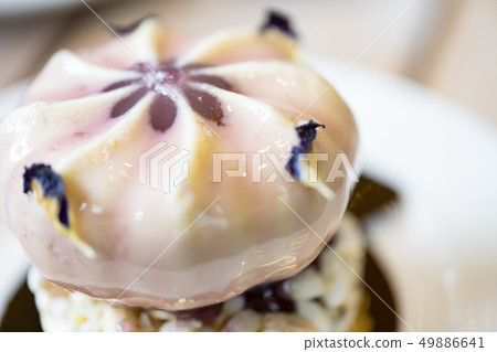 Legal and moral. Top surface rice, fruit freeze, soy sauce, white power, dried flowers. 49886641