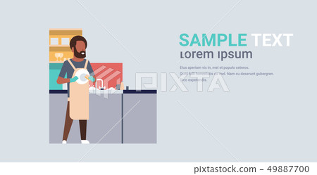 young man washing dishes african american guy wiping plates on kitchen doing housework dishwashing 49887700