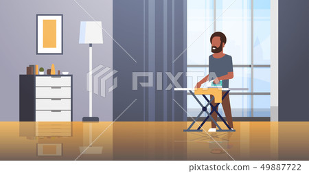 man ironing clothes african american guy holding iron doing housework housekeeping concept modern 49887722