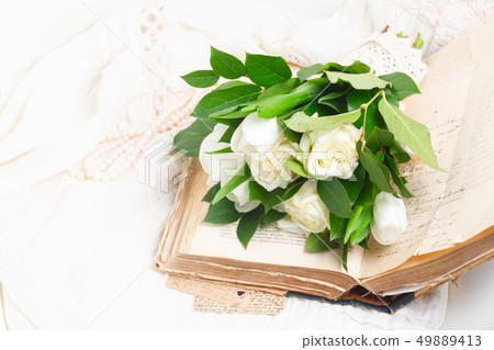 Old books with flowers 49889413
