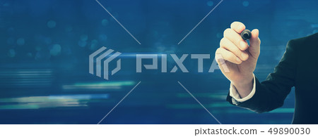 Businessman holding a pen Businessman holding a pen 49890030