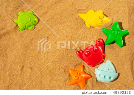 Toys on beach 49890338