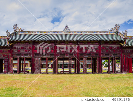 Covered corridor with red shutters, Hue, Vietnam 49891176