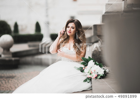 Beautiful fashion bride in wedding dress posing 49891899