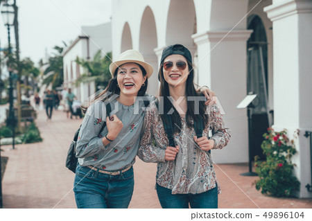 girl tourist smiling walking on street shopping 49896104