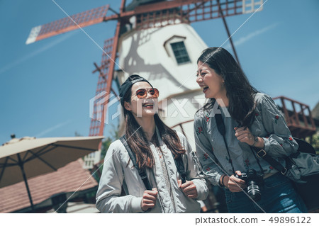 best friends travel smiling sightseeing windmill 49896122
