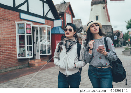 two happy women walking in Copenhagen city street 49896141