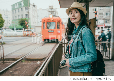 tourist camera take pictures of train running 49896189