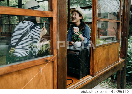 smiling women with tea bowls in chado outdoor 49896310