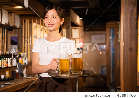 A girl who works part-time in a tavern 49897400