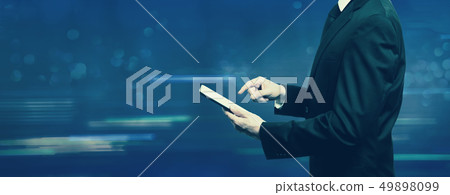 Businessman holding a tablet computer Businessman holding a tablet computer 49898099