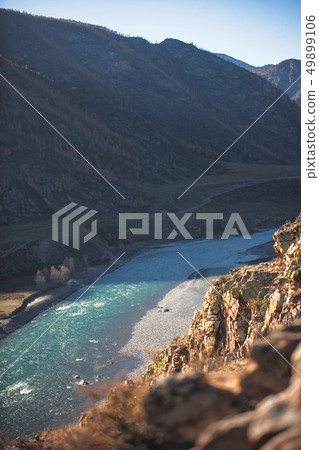 Amazing landscape with mountains, beautiful curving river, autumn forest in Altai. Mountain valley. Amazing landscape with mountains, beautiful curving river, autumn forest in Altai. Mountain valley. 49899106