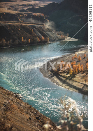 Amazing landscape with mountains, beautiful curving river, autumn forest in Altai. Mountain valley. 49899111
