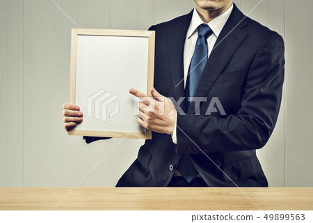 Men holding a board Men holding a board 49899563