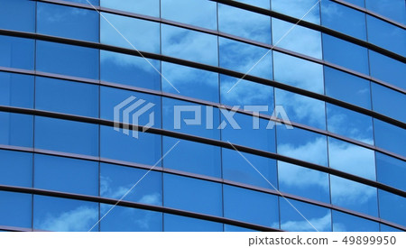 Blue sky on a window glass of a building Blue sky on a window glass of a building 49899950