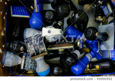 Many rubber stamps are put together in a basket. Many rubber stamps are put together in a basket. 49900992