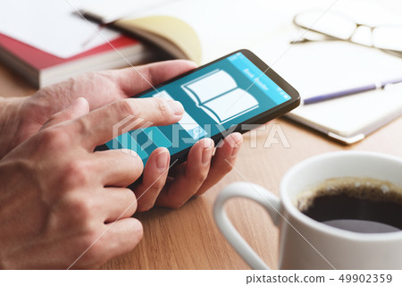 Close-up of male hand reading on smartphone. Close-up of male hand reading on smartphone. 49902359