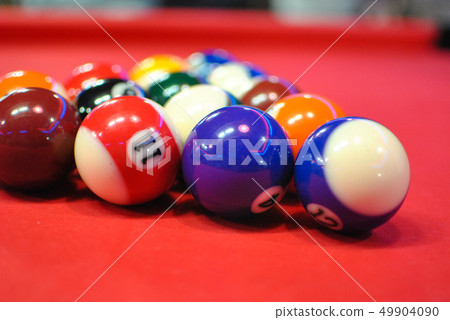 Billiard ball above the pool table 49904090