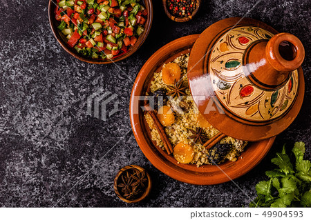 Traditional moroccan tajine of chicken with dried Traditional moroccan tajine of chicken with dried 49904593