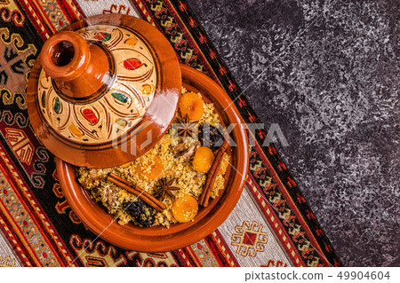 Traditional moroccan tajine of chicken with dried 49904604