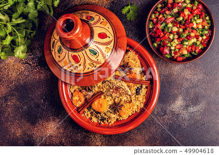 Traditional moroccan tajine of chicken with dried Traditional moroccan tajine of chicken with dried 49904618