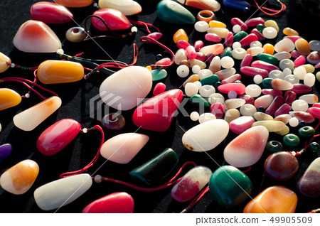 Many colorful jade stones in chinese market 49905509